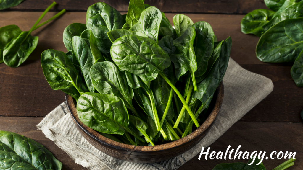 mature spinach leaves are darker green, long and oval shaped with green stems