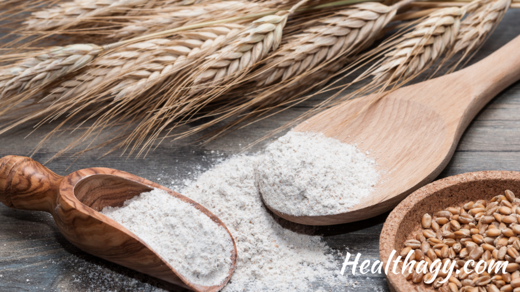 grass stems of the wheat plant, white ground flour and brown whole wheat grains