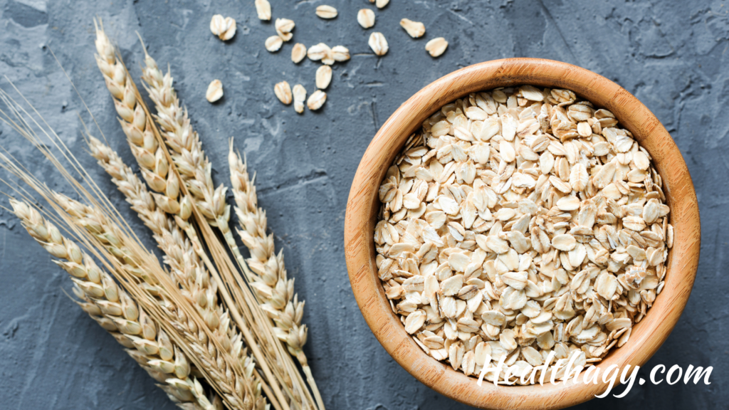 bowl of oats next to oat stems