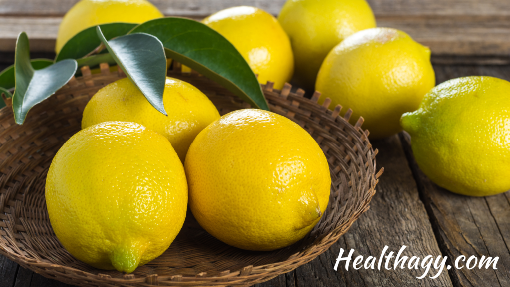 bright yellow lemons in a brown basket on a table